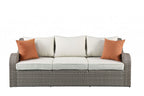 3-Piece Outdoor Gray Wicker Sectional Seating Group - Sofa and Ottomans with Beige Cushions and Glass-Top Coffee Table  Warm Home View