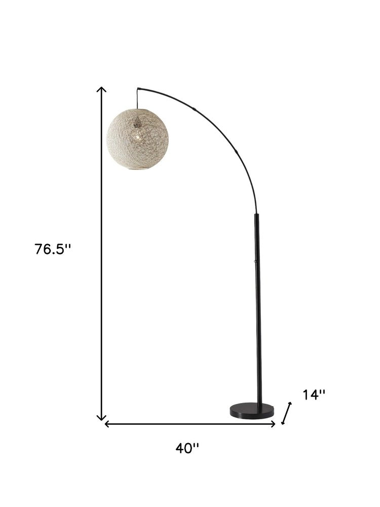 77" Antiqued Bronze Arched Floor Lamp With Groovy Beige Abstract Wicker Globe Shade  Warm Home View
