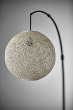 77" Antiqued Bronze Arched Floor Lamp With Groovy Beige Abstract Wicker Globe Shade  Warm Home View