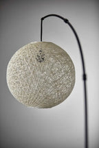 77" Antiqued Bronze Arched Floor Lamp With Groovy Beige Abstract Wicker Globe Shade  Warm Home View
