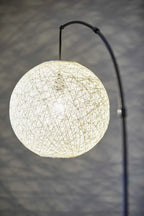 77" Antiqued Bronze Arched Floor Lamp With Groovy Beige Abstract Wicker Globe Shade  Warm Home View