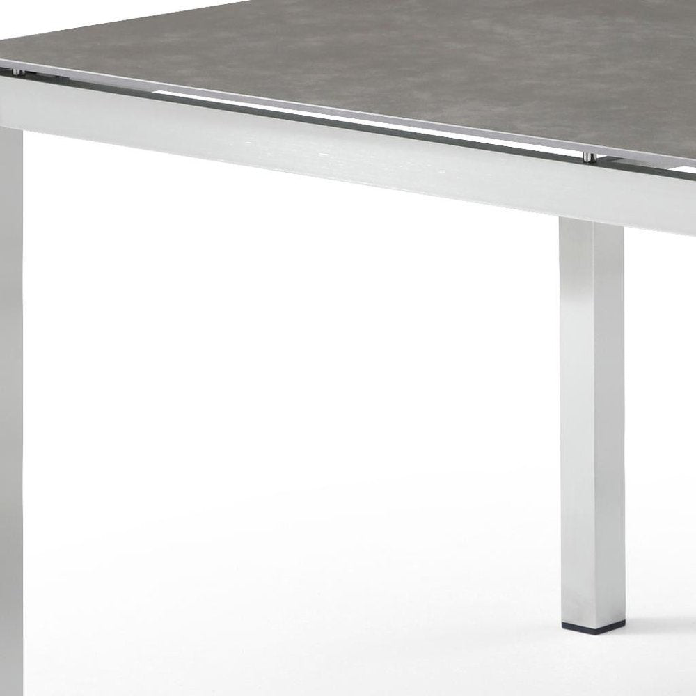 63" Dark Gray and Silver Ceramic Glass and Stainless Steel Outdoor Dining Table  Warm Home View